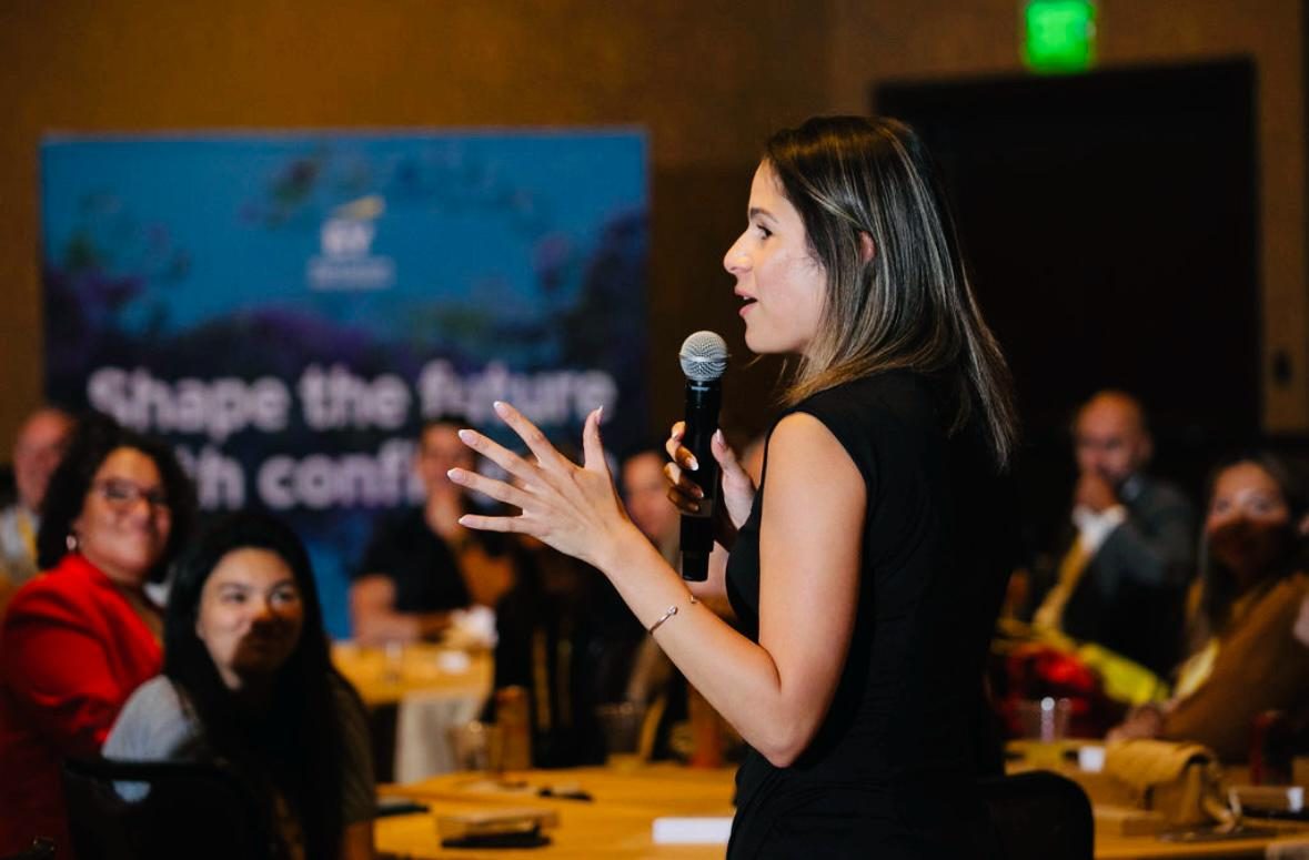 Jazzlyn speaking on a panel in front of an audience